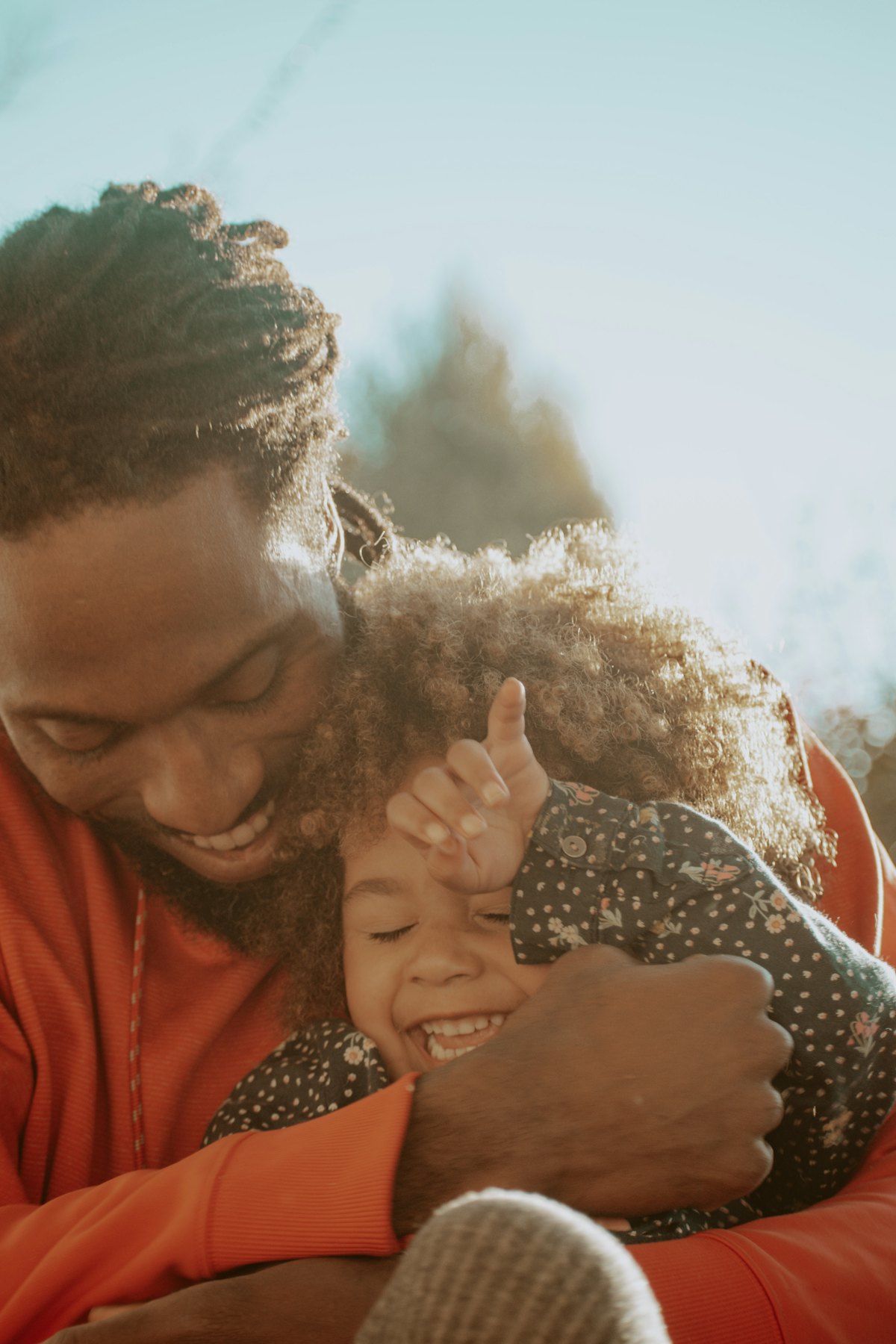 A father holding his child tenderly